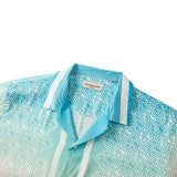 Camisa hawaiana tropical de manga corta con cuello campamento y estampado de estatuas vintage